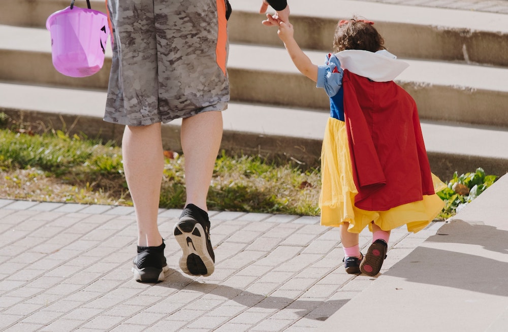 safe Halloween - parent and child trick-or-treating